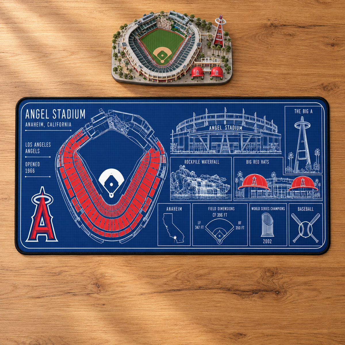 Los Angeles Angels Angel Stadium blueprint desk mat, 16" x 32", on a wooden desk with a decorative stadium model